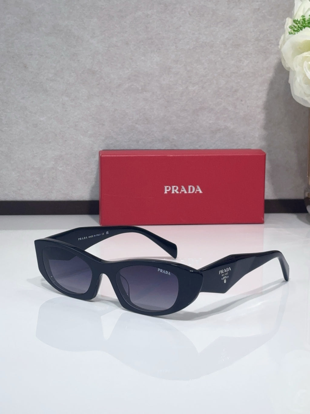 Cat-eye glasses with dark frames and dark lenses