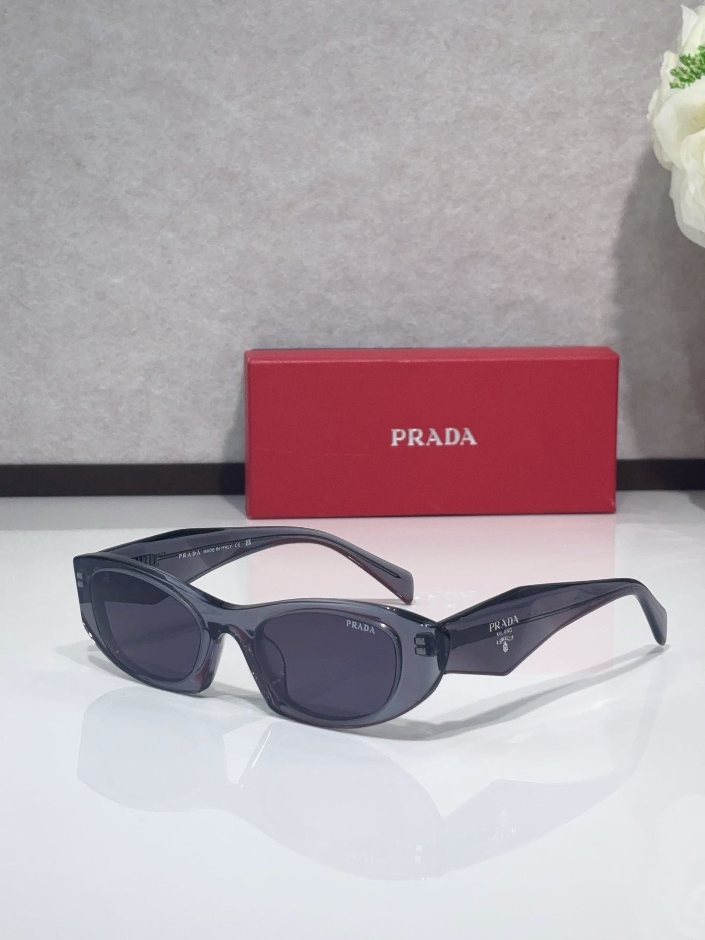 Cat-eye glasses with dark frames and dark lenses