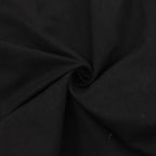 Dark fabric of the pants with soft drape and fine texture