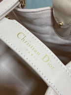 White leather strap with gold “Christian Dior Paris” lettering and stitching