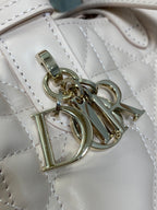 Dior quilted handbag hardware close-up with gold-tone clasp and rings