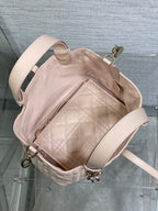 Dior quilted handbag interior with zipper pocket and light pink lining
