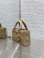 Beige quilted mini handbag with double top handles and gold-tone chain strap