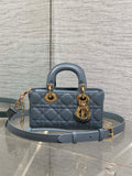 Dior quilted handbag in powder blue with top handles and gold chain strap hardware