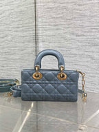 Dior quilted mini handbag in powder blue with top handles and gold chain strap
