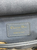 Dior handbag leather logo tag reading "Christian Dior" and "Made in Italy"