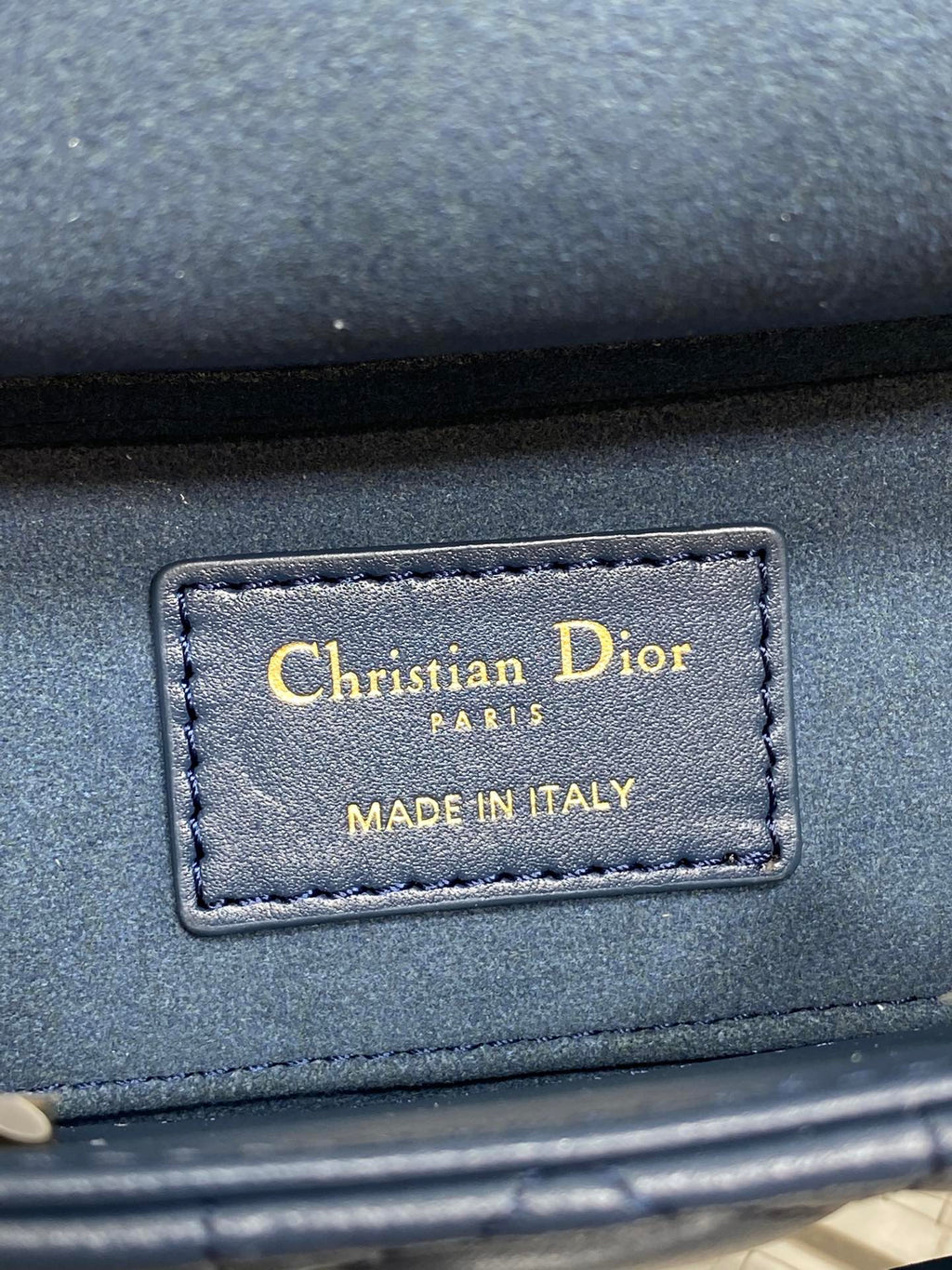 Dior handbag interior label: Christian Dior Paris Made in Italy on navy leather