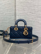 Dior mini handbag in navy quilted leather, gold-tone top handles and chain strap