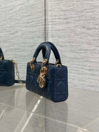 Dior mini handbag in navy quilted leather with gold-tone chain strap and top handles