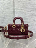 Dior quilted small handbag with top handles, burgundy leather, gold-tone logo charm
