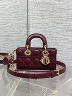 Dior quilted small handbag with top handles, burgundy leather, gold-tone logo charm