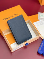 Small Louis Vuitton leather card holder with blue tab detail, dark blue