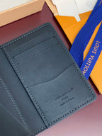 Small Louis Vuitton leather card holder, card slot panel with logo embossing