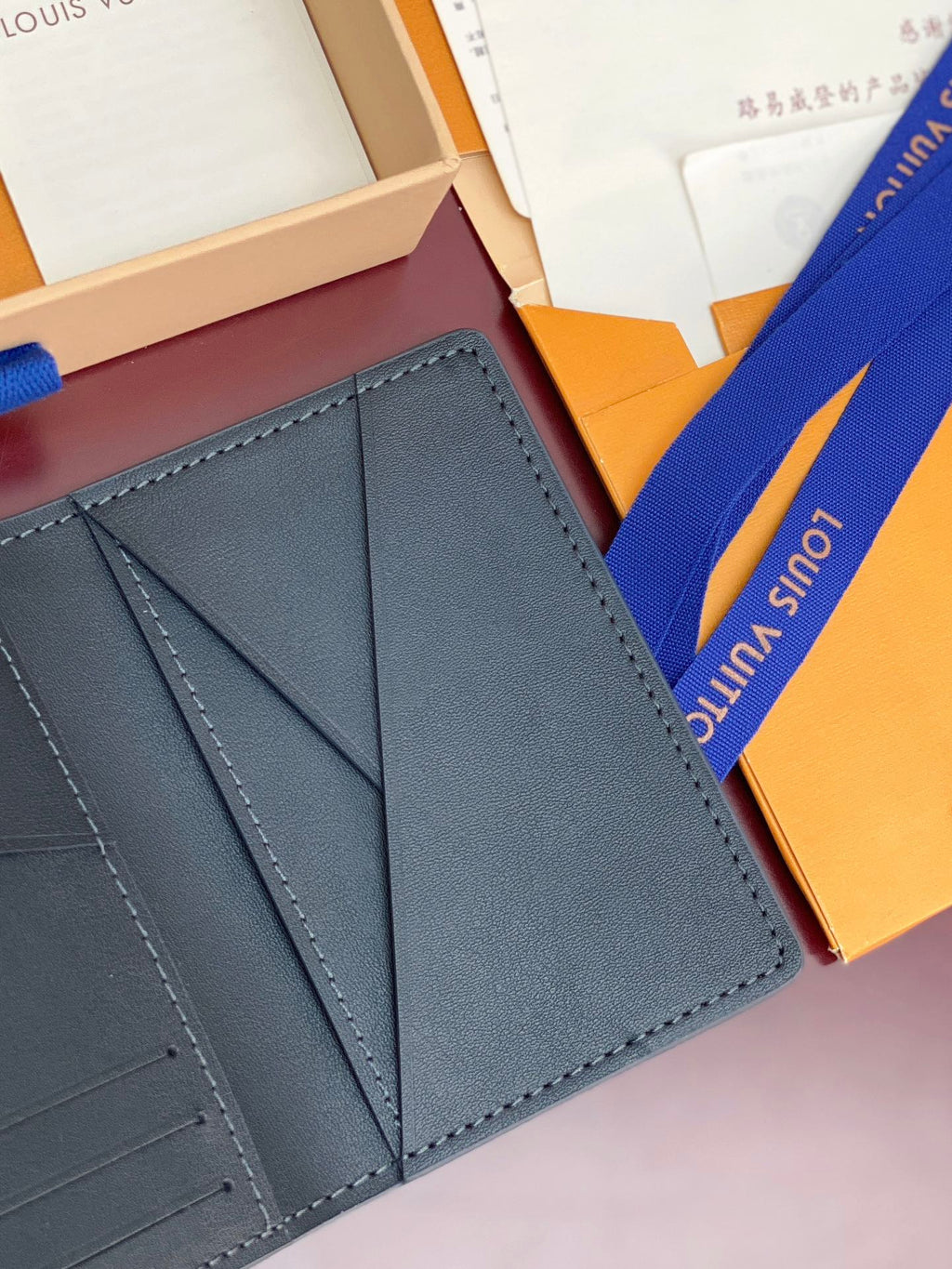 Small Louis Vuitton leather card holder, interior panels with stitched edges