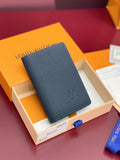 Small Louis Vuitton leather card holder, dark blue textured finish