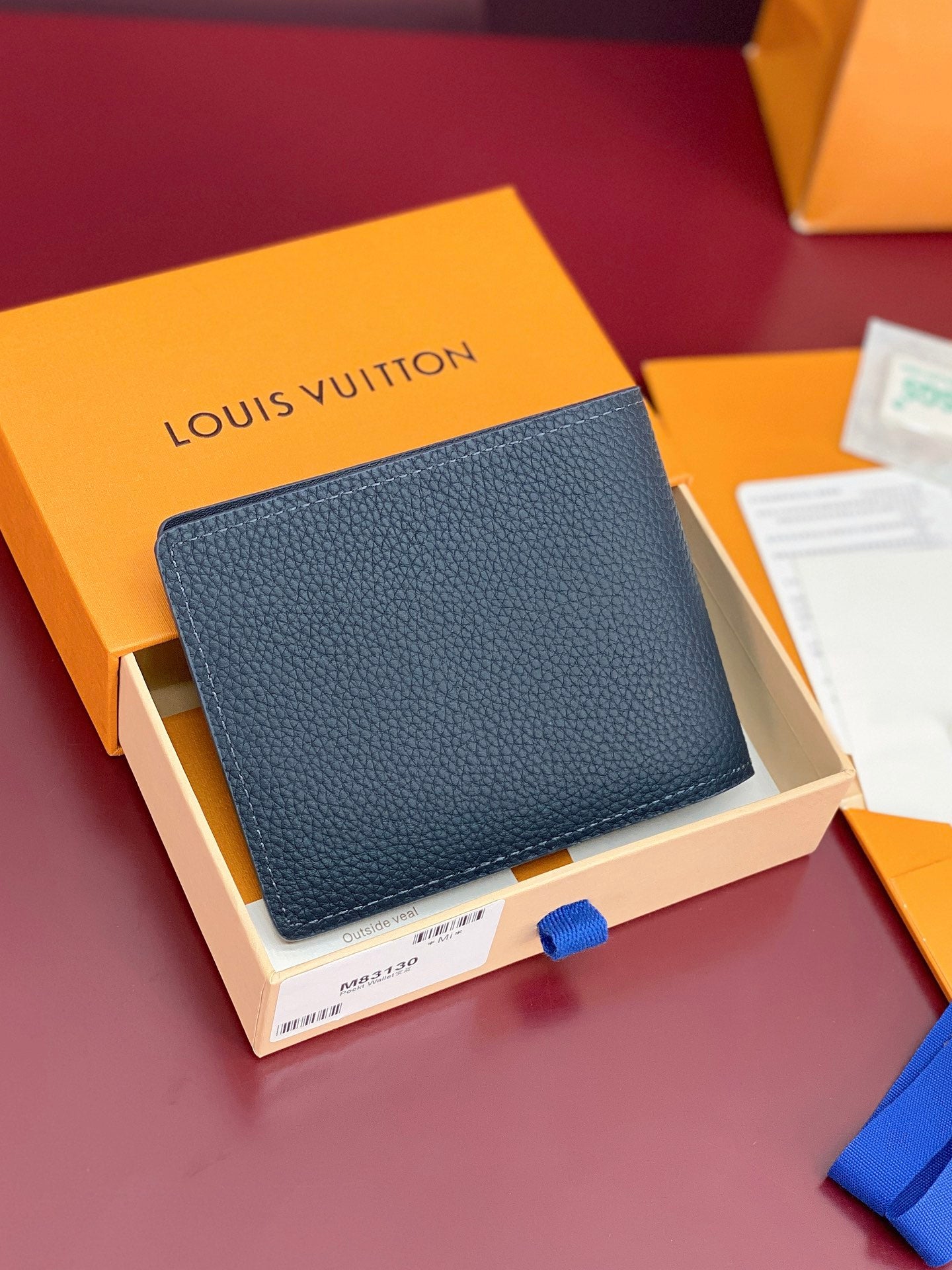 Louis Vuitton small bag in dark blue textured leather with stitched edges