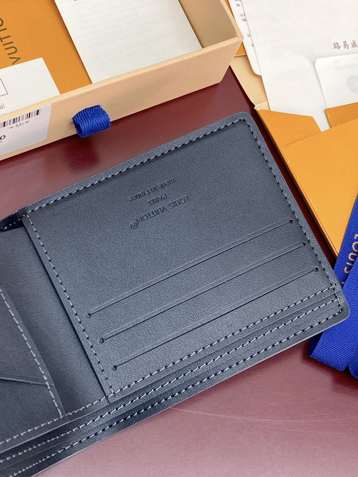 Louis Vuitton small bag, dark blue leather card holder with multiple interior slots