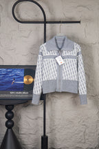Grey and white knit jacket with allover monogram pattern, stand collar, zipper front