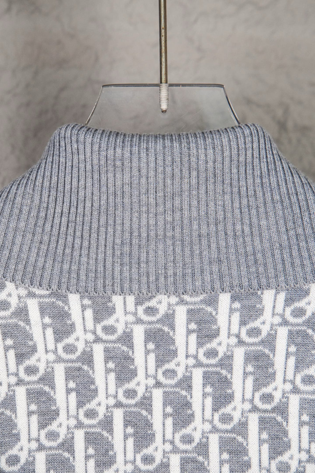 Grey ribbed turtleneck sweater knit with monogram panel at hem