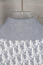 Grey ribbed turtleneck sweater knit with monogram panel at hem