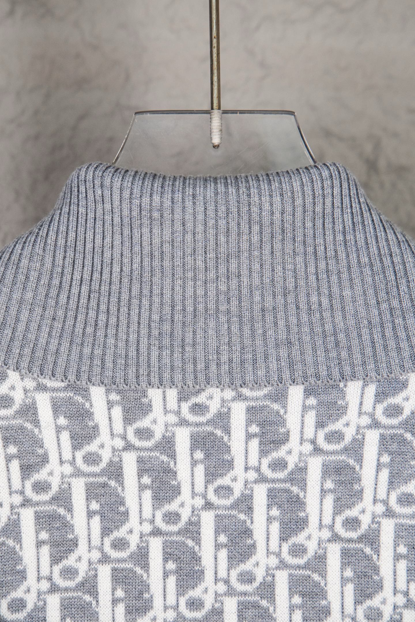 Grey ribbed turtleneck sweater knit with monogram panel at hem