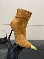 Tan suede ankle boot with pointed gold-tone toe and back zip detail