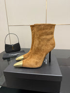 Tan suede ankle boot with pointed gold-tone toe and stiletto heel