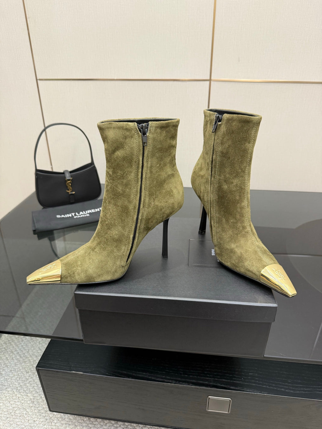 Ladies’ olive suede ankle boots with tall shafts, slim heels, and pointed gold-tone toes