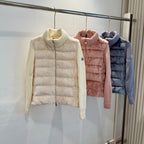 Cream long puffer jacket with chunky rib knit turtleneck and quilted front.