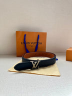 Navy leather belt with gold LV buckle, resting on a dust bag