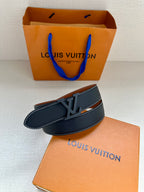 Louis Vuitton dark blue leather belt with LV buckle and tan interior edge
