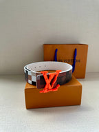 Louis Vuitton belt with white leather lining, dark checkered strap, orange LV buckle