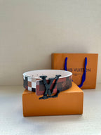 Louis Vuitton belt with red-brown check strap and bold dark V buckle, wide.