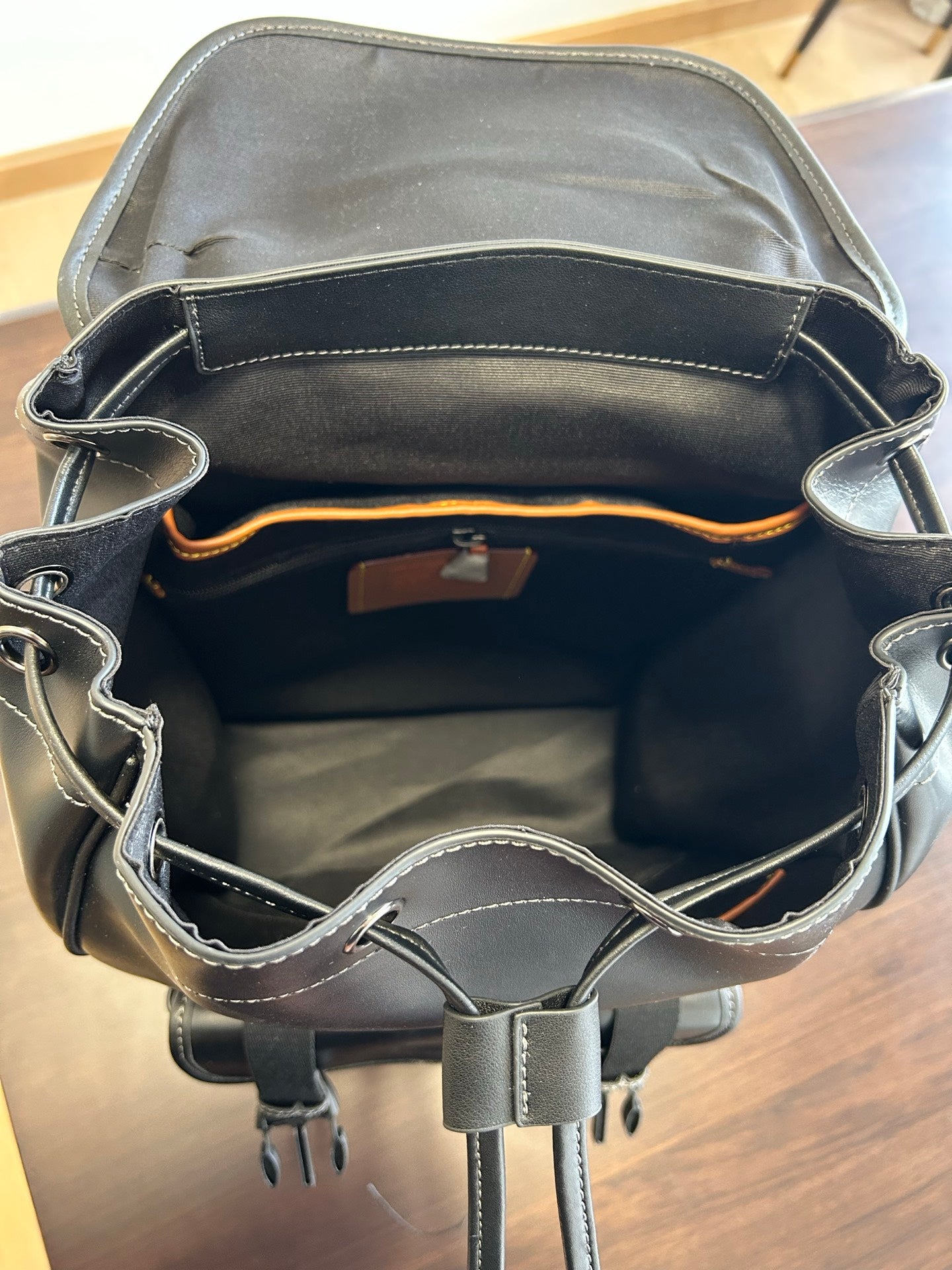 Coah leather backpack bag open view with interior lining and dual side handles