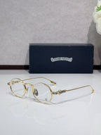 Round metal glasses with gold frames and clear tinted lenses