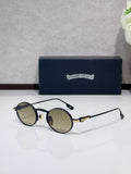Round metal glasses with black frames and brown tinted lenses