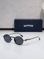 Round metal glasses with black frames and dark gray tinted lenses