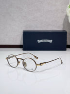 Round metal glasses with bronze frames and clear lenses