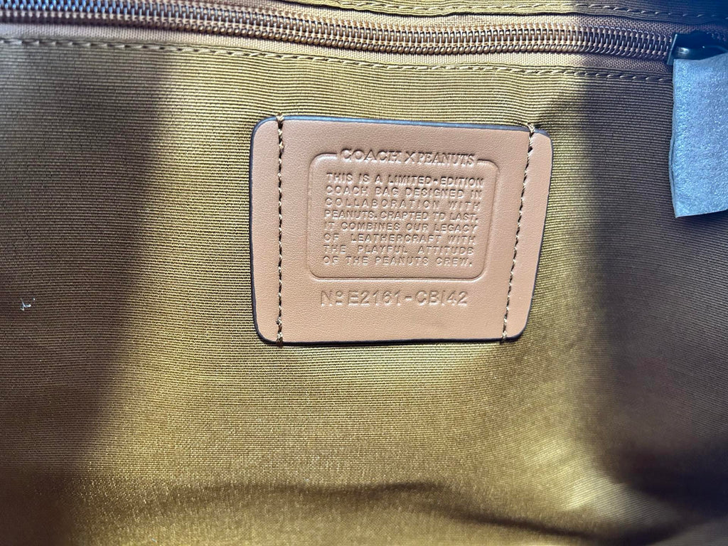 Coah bag interior label patch on lining with printed text and model code
