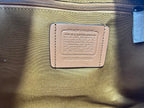 Coah bag interior label patch on lining with printed text and model code