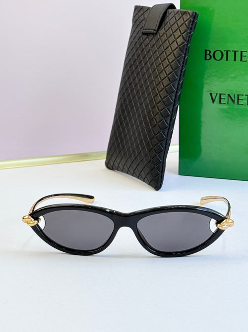 Bottega Veneta black cat-eye glasses with dark gray lenses and gold-tone hinges