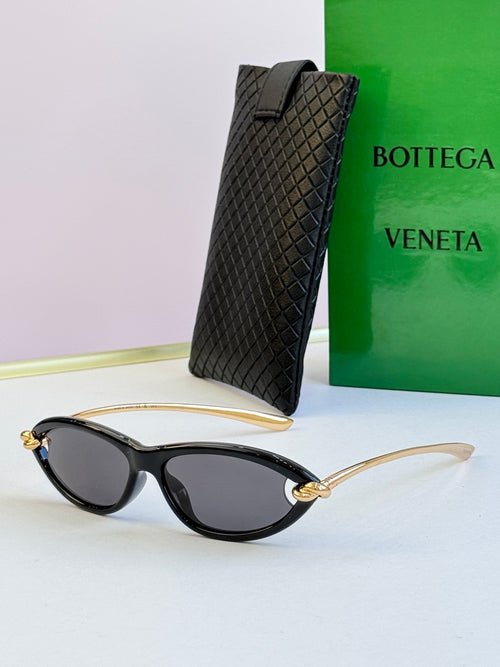 Bottega Veneta black cat-eye glasses with dark gray lenses, gold-tone temples