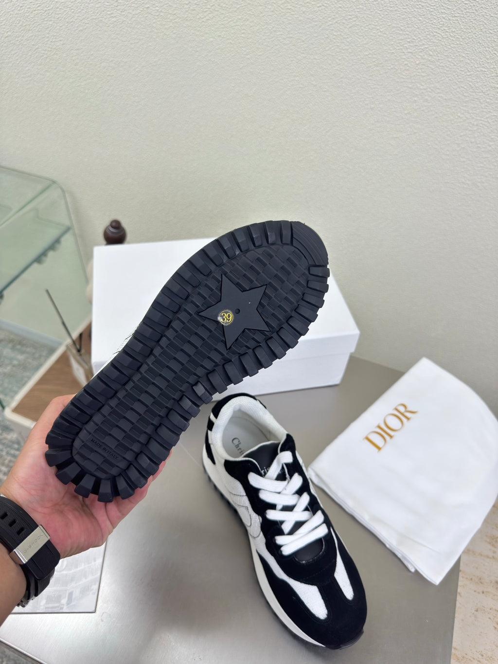 Black low-top sneakers showing textured outsole with contrast sneakers upper