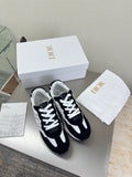 Black and white lace-up sneakers with white laces and contrast side panels