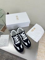 Black and white lace-up sneakers with white laces and contrast side panels