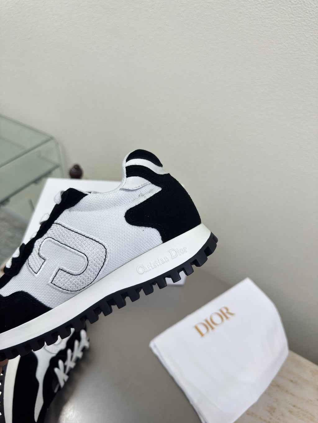 White and black lace-up sneakers with side logo and contrast stitching