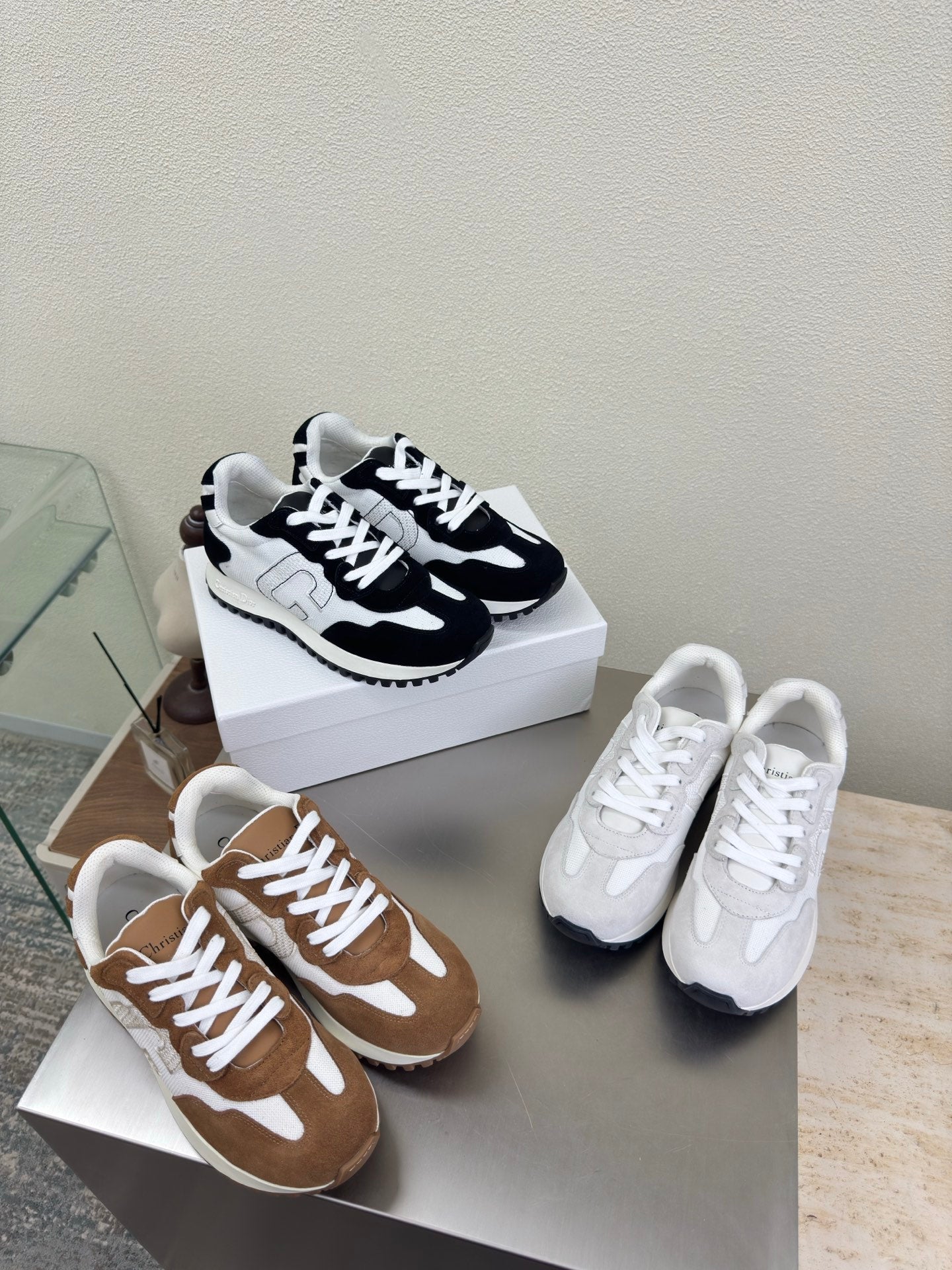 Color-block lace-up sneakers: white and black pair plus brown and tan pair
