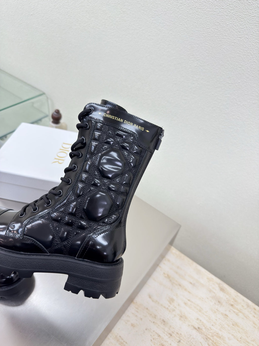 Black patent lace-up boots with Dior logo detail and chunky tread sole