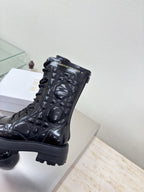Black patent lace-up boots with Dior logo detail and chunky tread sole