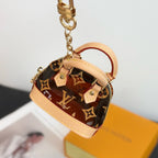 Louis Vuitton monogram mini handbag keyring charm with gold clasp and pink trim